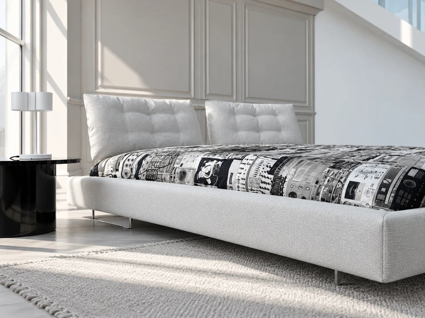Limes Large bed seen from the side, showing the low upholstered frame and two tufted head cushions